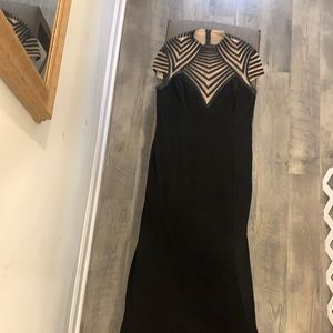 Black/tan Dress wear/ top is netting under black stripes/ 95% poly-5% spandex